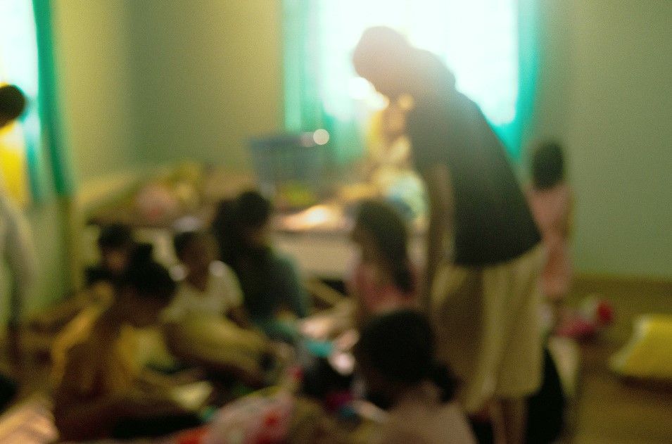 Survivors at shelter, blurred to protect identity